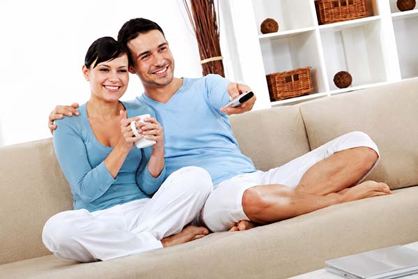 Couple sitting on cleaned uphostery Couple sitting on cleaned uphostery